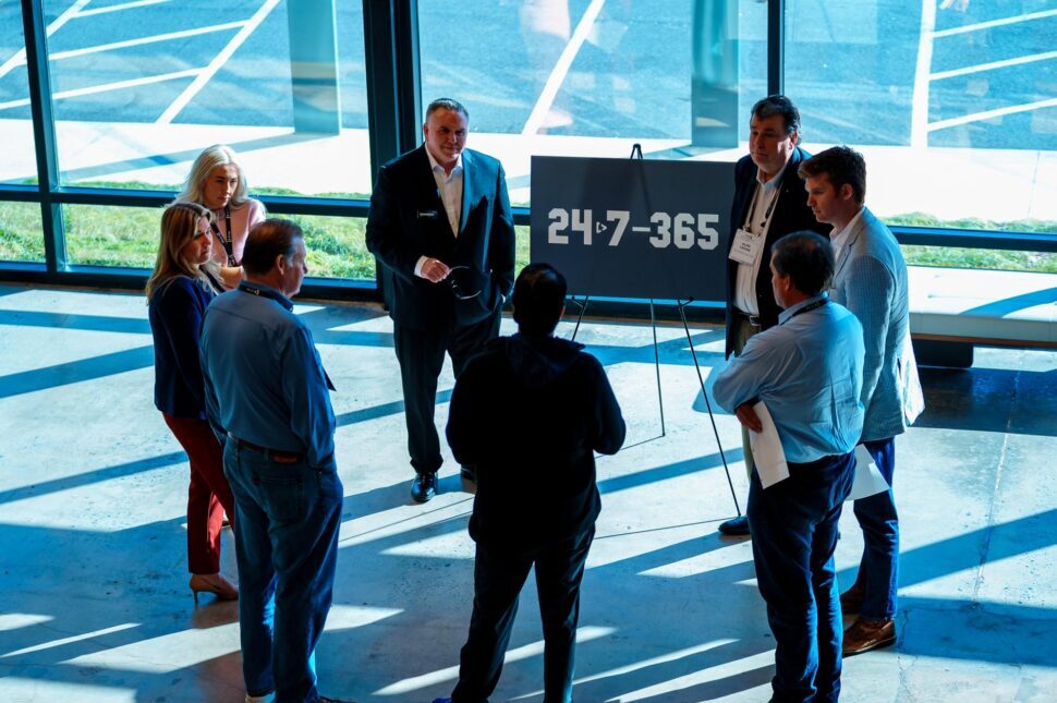 Law firm owners networking at a group coaching event